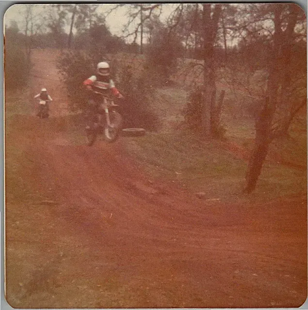 Vtg Color Snapshot Man Jumping Dirt Bike Motocross Racing Track Outdoors 1970s